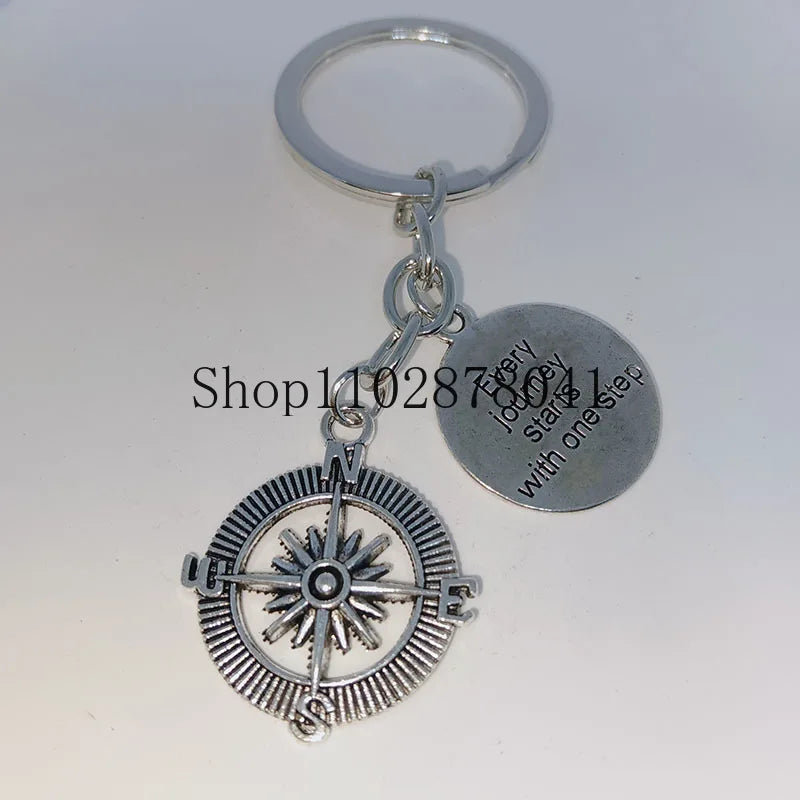 Keychain With The Positive Message ("Every journey starts with one step") With Compass