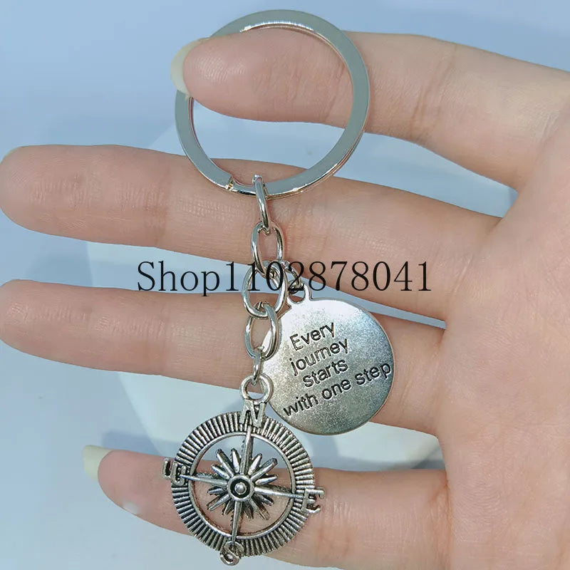 Keychain With The Positive Message ("Every journey starts with one step") With Compass